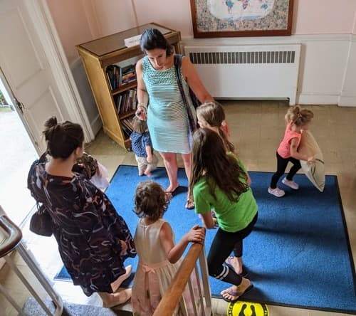 Families arriving through the front doors of East Baptist Church on a Sunday morning